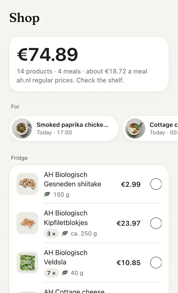 The Shop screen: €74.89 for 14 products and 4 meals at ah.nl regular prices, then the fridge items to buy.